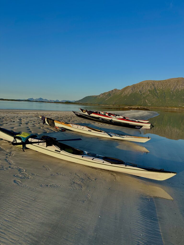 Midnight sun in Lofoten with kayaks